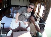 James driving a houseboat in the Keralan Backwaters